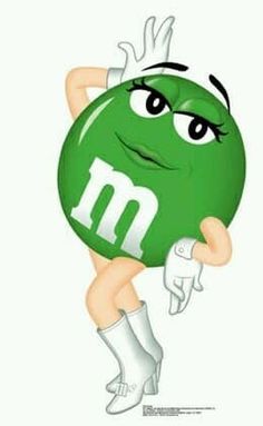 a woman holding a green ball with the letter m on it's face and arms