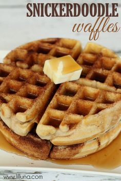 two waffles with butter and syrup on top