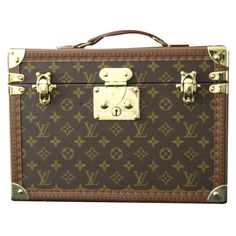 This Louis vuitton beauty case features monogram canvas and all brass fittings.Its main lock as well as its 2 latches are in solid brass and are stamped Louis Vuitton.  All studs are marked Louis Vuitton. Its large and comfortable top leather handle is embossed Louis Vuitton too.  Its interior is all beige coated canvas, with adjustable leather straps for holding materials. It still has got its removable little suitcase with a mirror under its lid. It also still has its original Louis Vuitton serial number label.It is very clean and fresh. It comes with its 2 working keys.  It is all original complete and in very good condition.  It could be used for traveling in style but can also turn into a perfect high end decoration piece.    Designer: Louis Vuitton  Brand: Louis Vuitton  Dimensions: Louis Vuitton Trunk Purse, Lv Steamer Trunk, Louis Vuitton Side Trunk, Louis Vuitton Soft Trunk Bag, Vintage Louis Vuitton Trunk, Train Case, Blanket Chest, Beauty Case, Decoration Piece