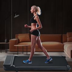 a woman is running on a treadmill