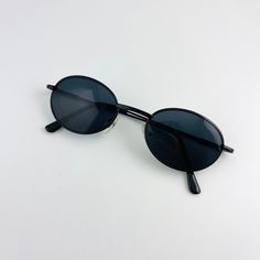 vintage 90s black oval sunglasses . black wire metal frame 400 uv excellent condition includes sunglasses pouch Black Oval Sunglasses, Wire Frame Sunglasses, Wire Sunglasses, Vintage Sunnies, Retro Shades, 90s Sunglasses, Small Sunglasses, Sunglasses Pouch, Black Round Sunglasses