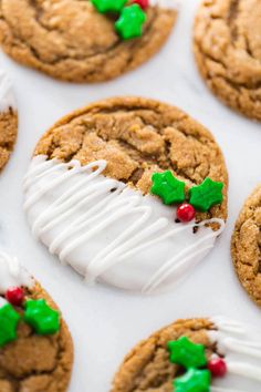 cookies decorated with white icing and holly leaves