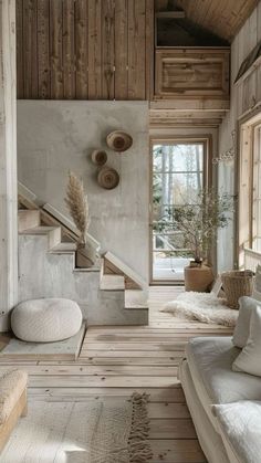 a living room filled with furniture and wooden walls