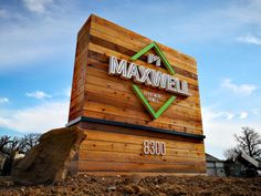 a large wooden sign that says maxwell on it