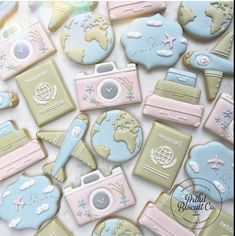 cookies decorated like travel related items on a table