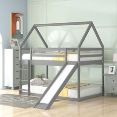 there is a bunk bed with a slide in the room