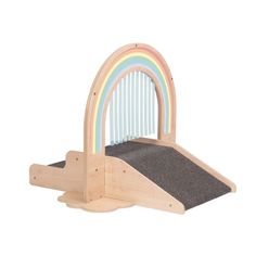 a child's wooden play set with a rainbow design