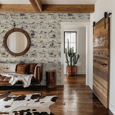 a living room filled with furniture and a large mirror on the wall next to a door