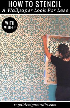 a woman is using stencil to paint a wallpaper look for less space