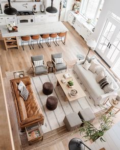 an overhead view of a living room and kitchen