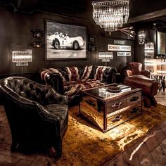 a living room filled with furniture and chandelier