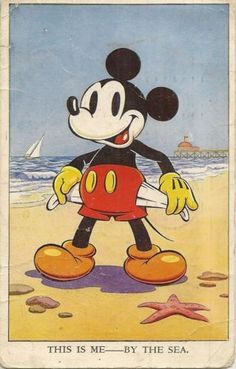 an old mickey mouse playing on the beach