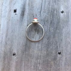 This is a lovely simple natural red coral ring. The setting is what I believe to be sterling silver but it is unmarked, and therefore I'm not 100% sure. (I have lowered the price for this reason) Vintage from the 1990's, this ring is in great condition with only minor signs of wear. Measuring a size 7 on my ring mandrel. This ring could be resized by a jeweler who is experienced working with vintage jewelry. If you have any questions please feel free to message me! I have standard shipping with Red Round Ring For Everyday, Everyday Red Round Ring, Red Minimalist Sterling Silver Ring, Minimalist Red Sterling Silver Ring, Red Nickel Free Rings, Red Moonstone Ring For Anniversary, Red Moonstone Anniversary Ring, Everyday Minimalist Red Rings, Red Minimalist Stackable Rings For Anniversary