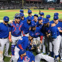 the chicago cubs pose for a team photo after winning the world series in 2013 at wrigley field