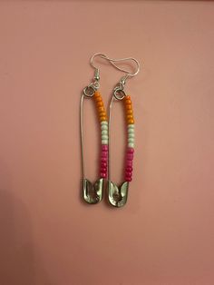 Celebrate Pride with homemade custom earrings! Can be personalized. Be sure to let me know which one(s) you are interested in. Flags include: lesbian, gay/mlm, transgender, bisexual, pansexual, nonbinary, asexual, genderfluid, agender, and aromantic, but will take personalization requests.  Silver and gold clip ons are available upon request. Gay Dangle Earrings, Queer Earrings, Genderfluid Earrings, Omnisexual Earrings, Beloved Jewelry, Lesbian Earrings, Lgbtq Earrings, Gay Rights, Pin Earrings