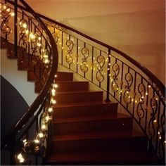 the stairs are decorated with christmas lights