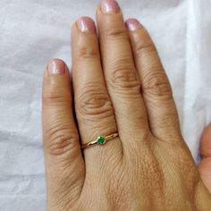 **KINDLY CHECK OUT THE VIDEO OF THE ITEM FOR A CLEARER VIEW**Details of the ring Gem: Emerald Gem shape and size: Round, 3 mm Gem weight: 0.08 carats Gold purity: 14K (58.33% approx.) Gold weight: 1.14 gms total weight of ring:1.16 gms Natural Emerald cut set in solid 14K yellow gold. The Gold purity is guaranteed and it comes with authentic 14 kt gold hallmark. Since these Rings are handmade, Size Customization is available for this ring and it is available in all ring sizes. Gemstone customiza 14k Gold Emerald Ring With Bezel Setting As Gift, 14k Gold Emerald Ring As May Birthstone Gift, 14k Gold Emerald Ring Gift For May Birthstone, Diamond Ring With Bezel Setting For May Birthstone Gift, Bezel-set Diamond Ring For May Birthstone Gift, Gift Emerald Diamond Ring With Bezel Setting, Bezel Set Diamond Ring For May Birthstone Gift, 14k Gold Emerald Birthstone Ring For Gift, 14k Gold May Birthstone Ring Gift