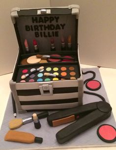 a birthday cake made to look like a makeup case