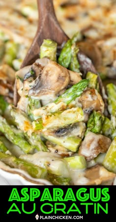 asparagus and mushroom casserole in a white dish with a wooden spoon