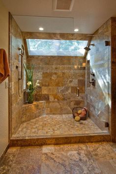 a walk in shower sitting inside of a bathroom