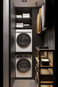 a washer and dryer in a small room with clothes hanging on the rack