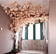 the room is decorated with flowers and curtains