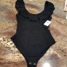 Free People Black Bodysuit. Ruffle Low Back. Size Extra Small. New With Tags. Chic Black Bodysuit With Ruffles, Black Summer Bodysuit With Ruffles, Black Ruffled Summer Bodysuit, Free People Bodysuit, Free People Black, Black Bodysuit, Low Back, Free People Tops, Free People