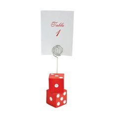 a red dice with two white dots on it is attached to a table number holder