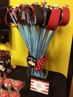 a table topped with lots of candy and lollipops