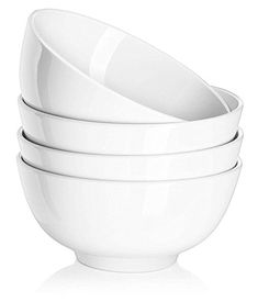 four white bowls stacked on top of each other