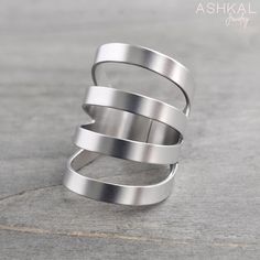 Our High Quality Stainless Steel Rings are sturdy, tarnish-free and made to last a lifetime. All our products are made by us with great care. Made in the USA with globally sourced high quality materials. Thoughtfully packaged with recyclable and biodegradable materials. This wide + edgy statement ring features 4 stripes that taper down to the back of the ring, making it very comfortable regardless of its length. Choose from 2 finishes: satin / mirror. DIMENSIONS:  3 cm (1.2") front (measuring fr Edgy Rings, Biodegradable Materials, Long Ring, Ring Making, Cuff Ring, Wide Ring, Cuff Rings, Stainless Steel Ring, Wide Rings