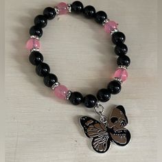 Beads Are Obsidian And Pink Jade. Silver Tone Spacers. Butterfly Charm With Skull Black Bracelets With Spacer Beads, Pink And Black Bracelets, Black And Pink Bracelet, Black Crystal Bracelet As Gift, Pink Jewelry With Black Beads For Gift, Dual Kawaii, Pink Charm Bracelet, Silver Star Bracelet, Diy Kandi Bracelets