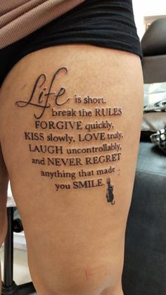 a woman's leg with a tattoo saying life is short break the rules for give quickly kiss slowly