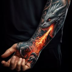 a man's arm with a dragon tattoo on it and flames in the air