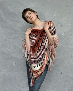 Crochet poncho in browns, Alpaca poncho wrap, Boho poncho in earth tones, Crochet cover-up. This crochet alpaca fringe poncho in earth tones is very soft and gentle. Poncho is lightweight and it's made of soft yarn - a blend of alpaca and silk, that's why it is very fluffy and soft to the touch. It will be the perfect accessory for spring and fall or even cool summer nights.  Size M/L Color: ecru and various shades of browns. Because of different monitors and screen resolutions, color may look different on the screen than in reality. If you want such poncho in any other color and size please feel free to contact me. I will be happy to make it for you. Care instructions: Hand washes in lukewarm water (30o C). Dry flat. Brown Fringed Poncho For Fall, Brown Fringe Poncho For Fall, Beige Bohemian Shawl Poncho, One Size Brown Fringe Poncho, Brown One Size Poncho With Fringe, Brown Fringe One Size Poncho, Brown Shawl Wrap For Fall, One Size Beige Bohemian Wrap, One-size Beige Bohemian Wrap