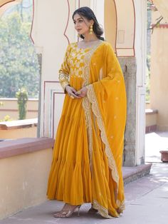 This stunning gown is perfect for any special occasion, with its vibrant yellow color and intricate sequin and embroidered work. The silk dupatta complements the gown beautifully, featuring matching sequin and embroidered work along with designer lace detailing.
Not only is it fully stitched and available in sizes XS to XXL, but it also has a generous 3.50-meter flair and a gown length of 56 inches. The 2.3-meter-long dupatta adds an elegant touch, making this ensemble a must-have for festivals, Haldi Wear, Engagement Gown, Lehenga Crop Top, Lehenga Choli Wedding, Floral Lehenga, Party Wear Lehenga Choli, Reception Gown, Bollywood Lehenga, Cocktail Wear