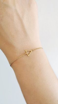 14K 9K Delicate Triangle Charm Bracelet, Geometric gold bracelet, Dainty Minimalist gold chain bracelet, Gift for Daughter, Birthday Gift, FREE EXPRESS SHIPPING Beautiful and delicate bracelet with a triangle frame charm made in 14K or 9K solid gold. Whsiper...I love Geometry! -------------------------------------------------- D E T A I L S 14K Solid Gold or 9K Solid Gold Dimensions: 10mmx10mm Soldered chain and jump rings with a spring clasp closure --------------------------------------------- Minimalist 14k Gold Charm Bracelet With Delicate Chain, Minimalist Yellow Gold Bracelet With Adjustable Chain, Minimalist Yellow Gold Bracelet With Delicate Chain, Gold-tone Gold Bracelet With Delicate Chain For Gifts, Minimalist 14k Gold Bracelet With Rectangular Shape, Triangle Frame, Music Note Necklace, Origami Necklace, Gold Chain Bracelet