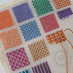 the cross stitch pattern is being worked on