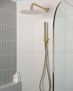 a shower head and hand shower in a bathroom