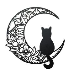 a black cat sitting on top of a crescent with flowers in the moon cutout