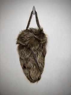 Our Clever Catch bag is a one of a kind piece. Genuine fox fur exterior, and vibrant genuine leather interior, this bag is a true catch of clever luxury. Lightweight chain strap detailing for comfortable all day wear.  This is a one of a kind piece. Only one was ever created. Handmade in NYC. Luxury Faux Fur Shoulder Bag With Fur Lining, Luxury Faux Fur Shoulder Bag, Luxury Faux Fur Evening Bag, Luxury Evening Bags In Faux Fur, Top Handle Bags, Fox Fur, Leather Interior, Leather Handbag, Bronx