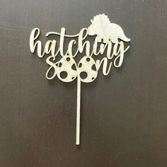 a cake topper with the word matching on it's side and an image of a