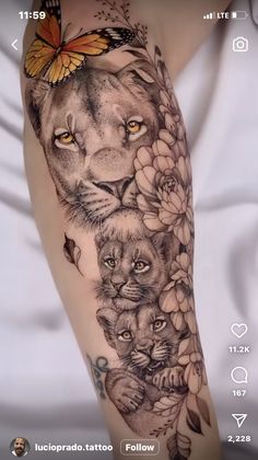 a woman's arm with a lion and flowers on it