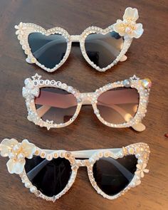 Bridal sunglasses I can crest them anyway you like : whatever colors, sunglass shape or phrases you prefer.  *I have an entire bridal party collection. & bulk orders are subject to discounts and free shipping. Bridal Sunglasses Brides, Wedding Reception Sunglasses, Wedding Heart Sunglasses, Heart-shaped Wedding Sunglasses For Summer, Bridal Sunglasses, Wedding Sunglasses, Wedding Apparel, Custom Sunglasses, Eyewear Sunglasses