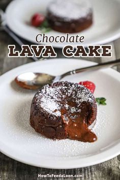 chocolate lava cake with powdered sugar and strawberries on white plate next to spoon