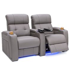 two reclining chairs with remotes on them