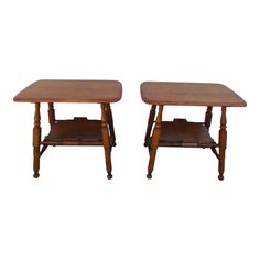 two wooden tables sitting next to each other