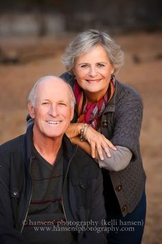 an older man and woman are smiling for the camera