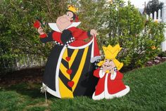 two cartoon figures are standing in the grass