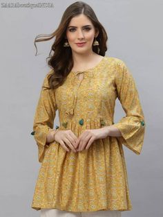 HAND CRAFTED TUNIC DESCRIPTION *Yellow printed tunic ,has a round neck, three-quarter sleeves, *Fabric:- Modal *Wash Care:- MACHINE WASH AVAILABLE IN 6 SIZES THEY ARE IN FOLLOWING MEASUREMENTS IN INCHES:- XS:- Bust-34/Waist In-30/Length-30 S:- Bust-36/Waist In-32/Length-30 M:- Bust-38/Waist In-34/Length-30 L:- Bust-40/Waist In-36/Length-30 XL:- Bust-42/Waist In-38/Length-30 XXL:- Bust-44/Waist In-40/Length-30 NOTE ►►CUSTOMISATION We do customisation ️ ►►TRACKING We give full tracking to our valu A Line Kurti, Indian Tops, Tunic Tops Summer, Indian Tunic, Printed Tunic Tops, Boho Tunics, Women Tunic Tops, Yellow Print, Print Tunic